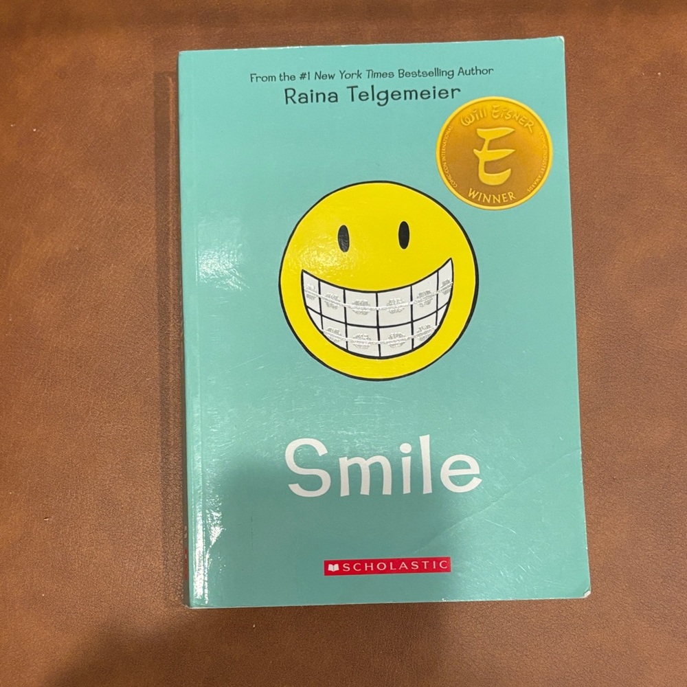 Scholastic Teal and Yellow Smile Graphic Novel